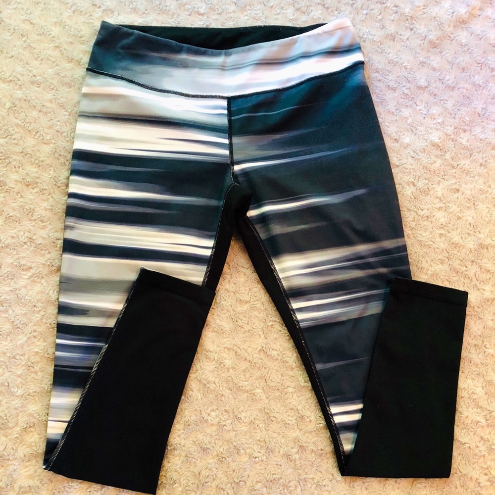 Black, Gray and White Leggings. Solid black on back.
